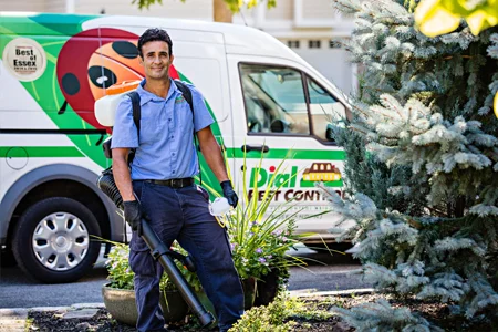 technician standing in front of Dial Environmental van