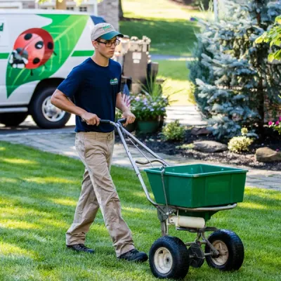 Dial Environmental lawn technician working a yard