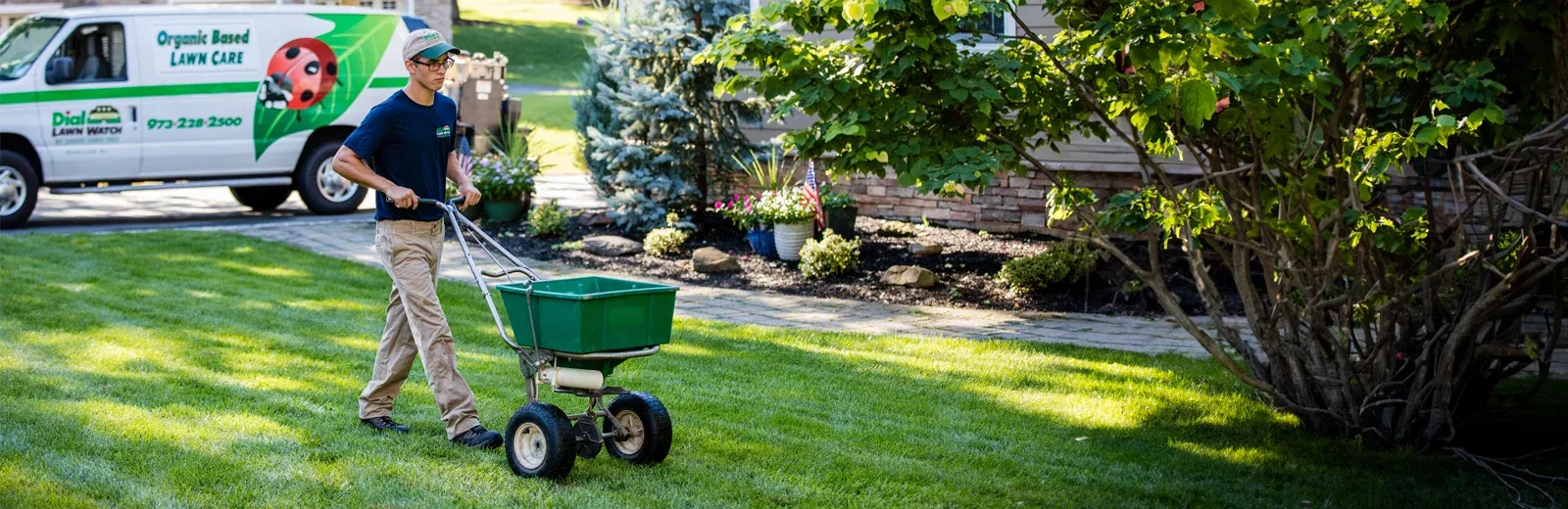 Dial Environmental Technician spreading grass seed